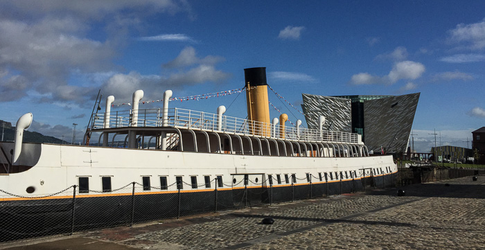 The SS Nomadic (restored tender) with the Titanic Museum in the background