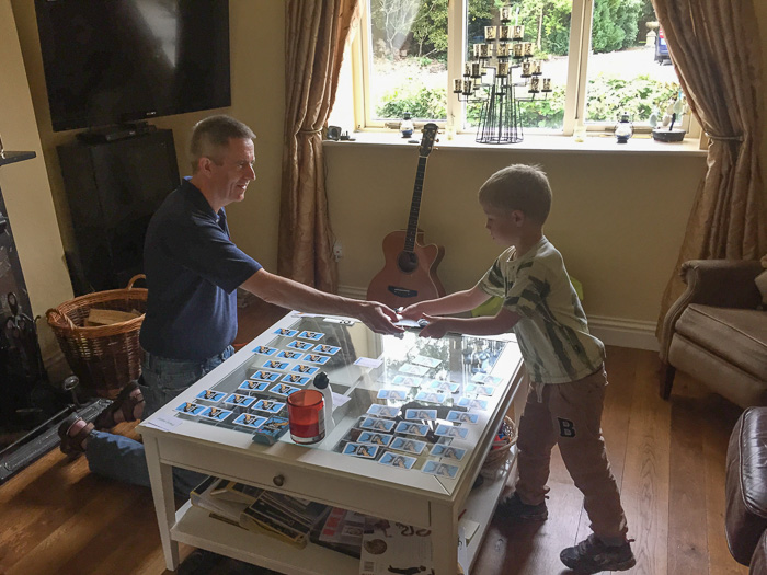 Our host and son playing dinosaur cards