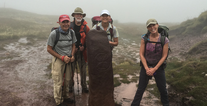 Our expanded crew posing with the ancient Ogham stone nestled in the Brandon Mountains