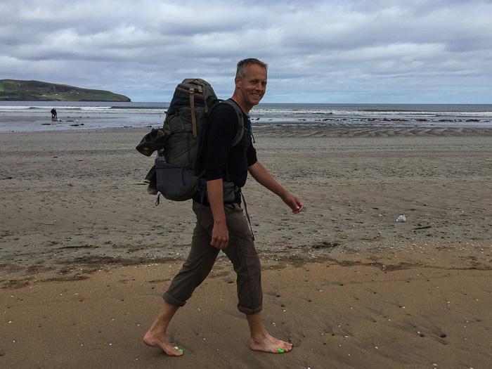 Chris thoroughly enjoying his barefoot beach walk.