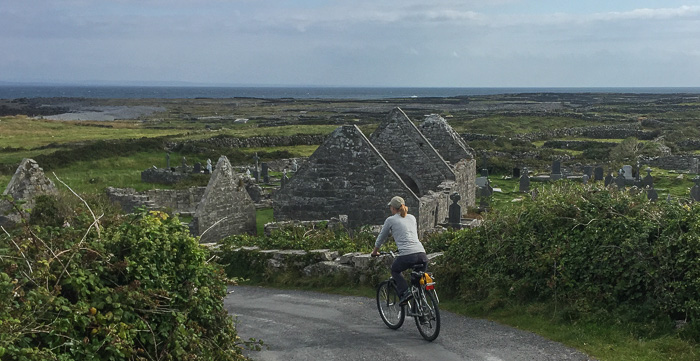 Julie riding down to the "The Seven Churches" on Inishmore