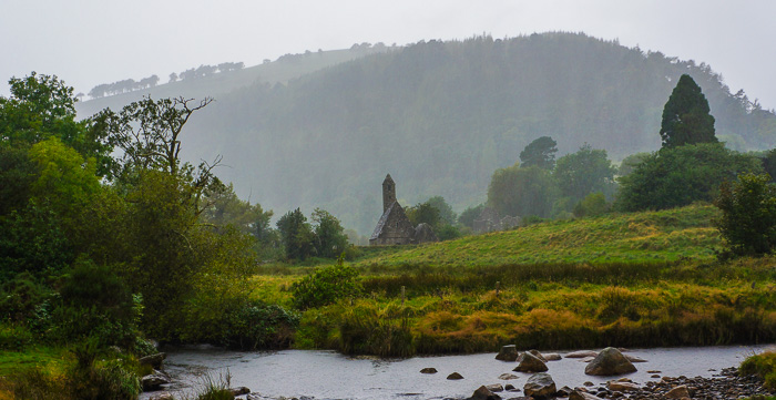 The monastic settlement at Glendalough, off in the misty distance