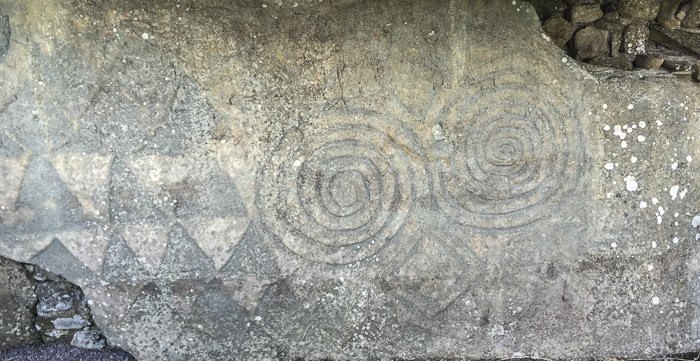 An example of megalithic artwork carved into a kerbstone at Newgrange