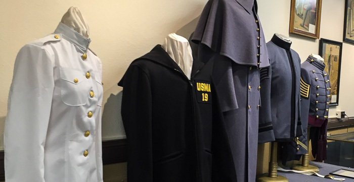 Display at the start of the uniform factory tour. They make all of these uniforms (and more) on-site.