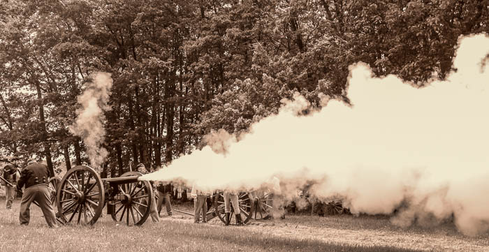 Union cannon firing a shot