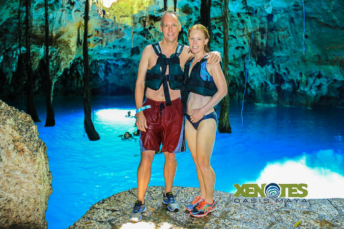 Chris and Julie in the Lu'um cenote. You can see dangling tree roots behind us, all of which abruptly stop at the waterline. Photo by Jaime of Xenotes Oasis Maya.