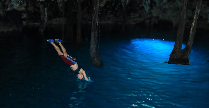 Chris diving into Lu'um. Photo by Jaime of Xenotes Oasis Maya.