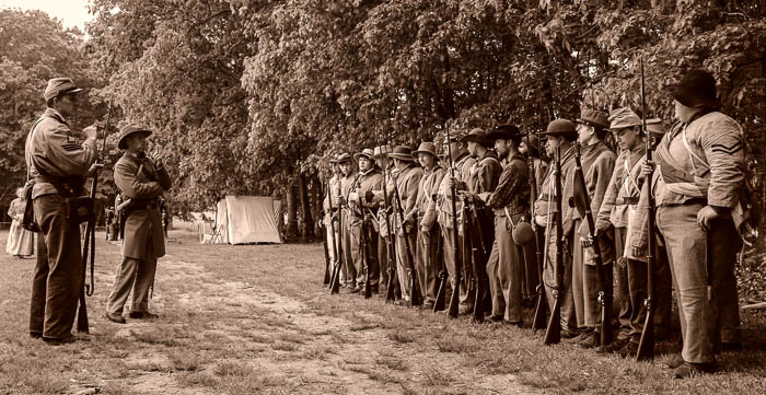Confederate troops forming up before battle. The first skirmish took place in the woods behind the line of soldiers.