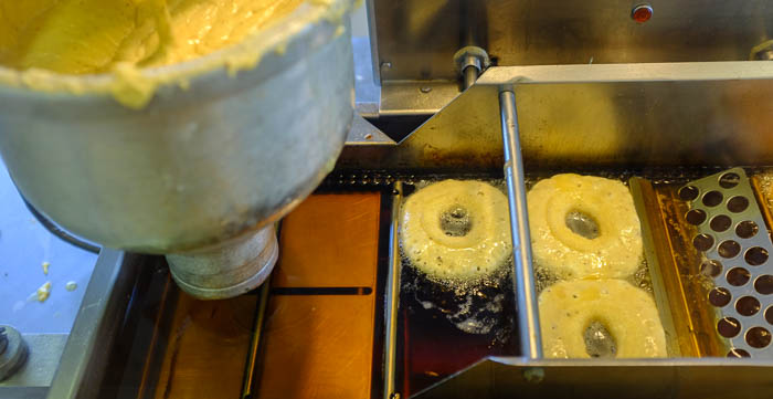 Donuts in the fryer at Andy's BBQ