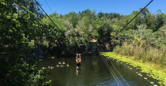 Zip-lining in the lik' cenote