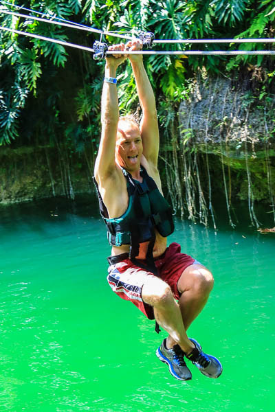 Chris zip-lining at the Káa'k' cenote. Photo by Jaime of Xenotes Oasis Maya.