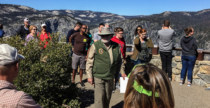 A park volunteer at Glacier Point shares tidbits about Firefall and forest health.
