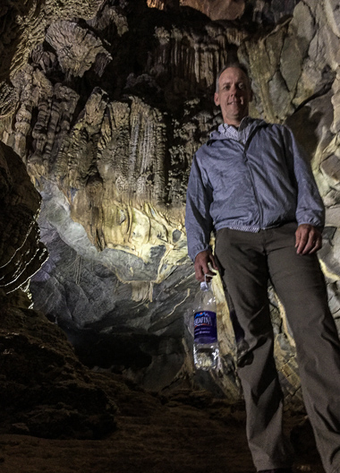 Chris in Phong Nha cave. After the boat tour, we were able to walk a bit. I was itching to explore more, but was happy to see it so well controlled and protected.