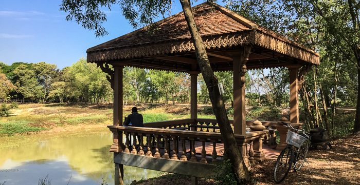 A small pond and shelter just beyond the mass graves at Choeung Ek. The shaded walk allows quiet time to reflect.