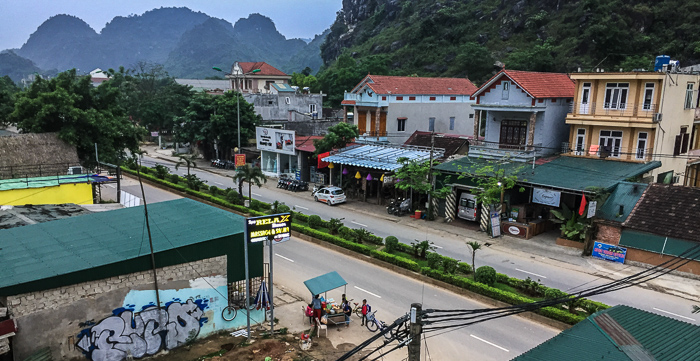Partial view of the main street running through Phong Nha town. This was taken early morning as I sat on my hotel balcony and watched school kids stop by the street vendor to pick up banh mi and a juice boxes for breakfast before school.