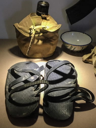 Display case in the Khe Sahn Museum showing a pair of Vietnamese sandals made from old tires. I'd read about these so often it was cool to finally see a pair!