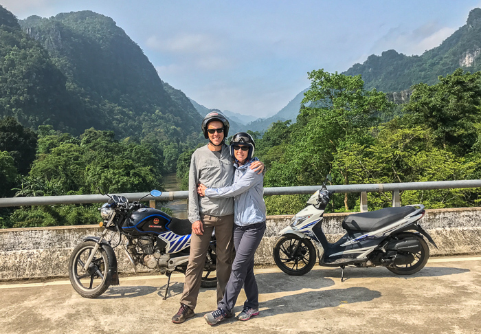 On a 3-day motorbiking trip in Vietnam. Although it was HOT, we were both glad to have long pants and light windbreakers along with sunglasses and good shoes.