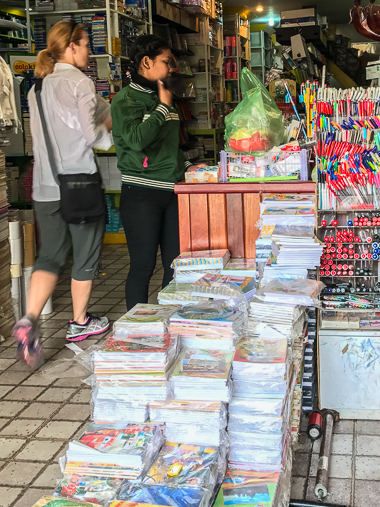 When arranging the tour I asked about donations and was told that notebooks are welcome since students go through them quickly. It was quite an adventure to find the right kind in Siem Reap, but I eventually prevailed (purchasing 10-packs of notebooks, pictured in the photo above) with the help of a young clerk. 