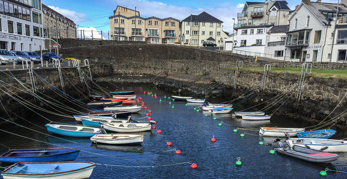 Fishing boats moored in a Portrush harbor
