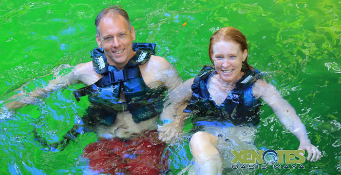 Chris and Julie swimming in a cenote
