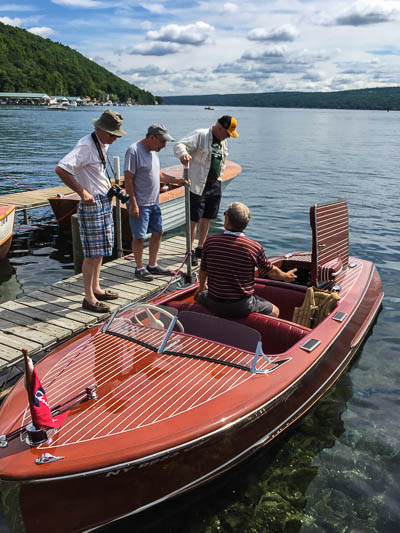 Folks chatting about this 1948 Chris Craft, a 17-foot restored classic runabout.