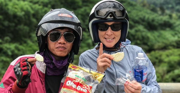 Having a quick snack of One-One, lightly sweet crispy rice wafers. I didn't know it at the time, but Bang bought two large bags of these treats for us to hand out to local village kids.